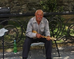 Busker outside Svetitskhoveli Cathedral
